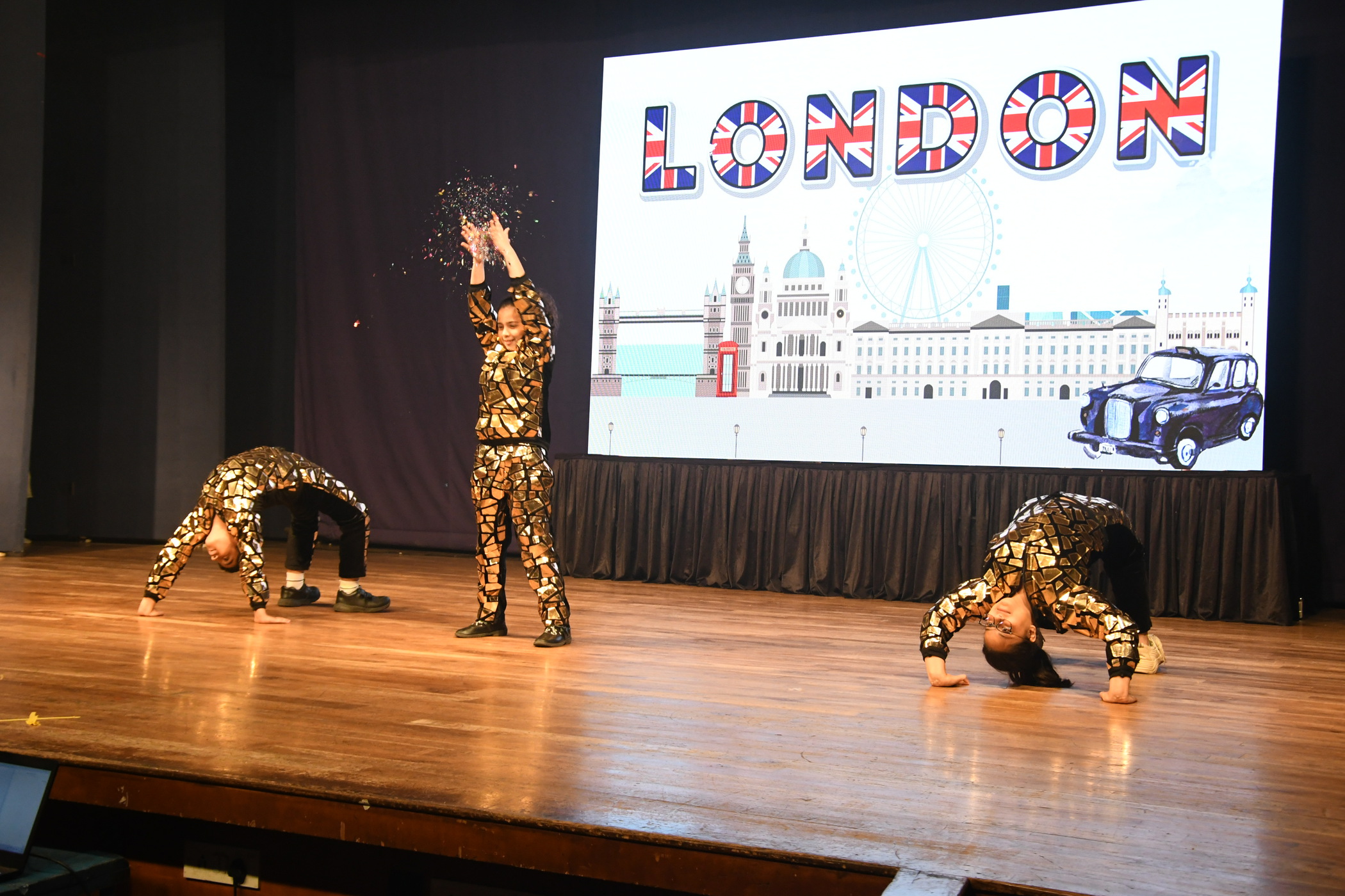 Students performing a dance on stage